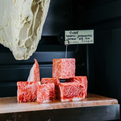 The Dry Age Boutique displays with beef coated in butter and wagyu beef cubes